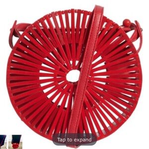 Red circular bamboo woven crossbody handbag